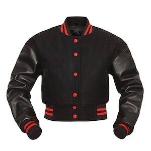 May include: A black varsity jacket with red trim and leather sleeves. The jacket has a button closure and a ribbed collar, cuffs, and waistband.