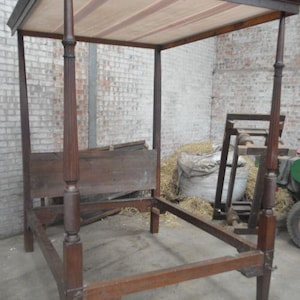 Early 19th-century mahogany four-poster bed frame.