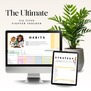 May include: A computer monitor and tablet displaying a Jiu Jitsu Fighter Tracker. The monitor shows a habit tracker with a cartoon lion and cub. The tablet displays a strategy guide. A potted plant is in the background.