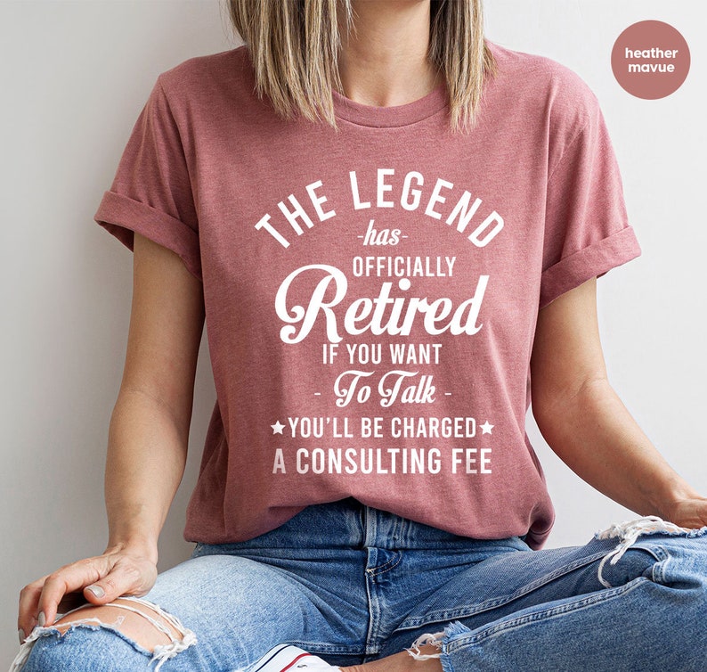 a woman in a red shirt is sitting down