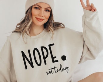 May include: A beige sweatshirt with the text "NOPE. not today" in black lettering.