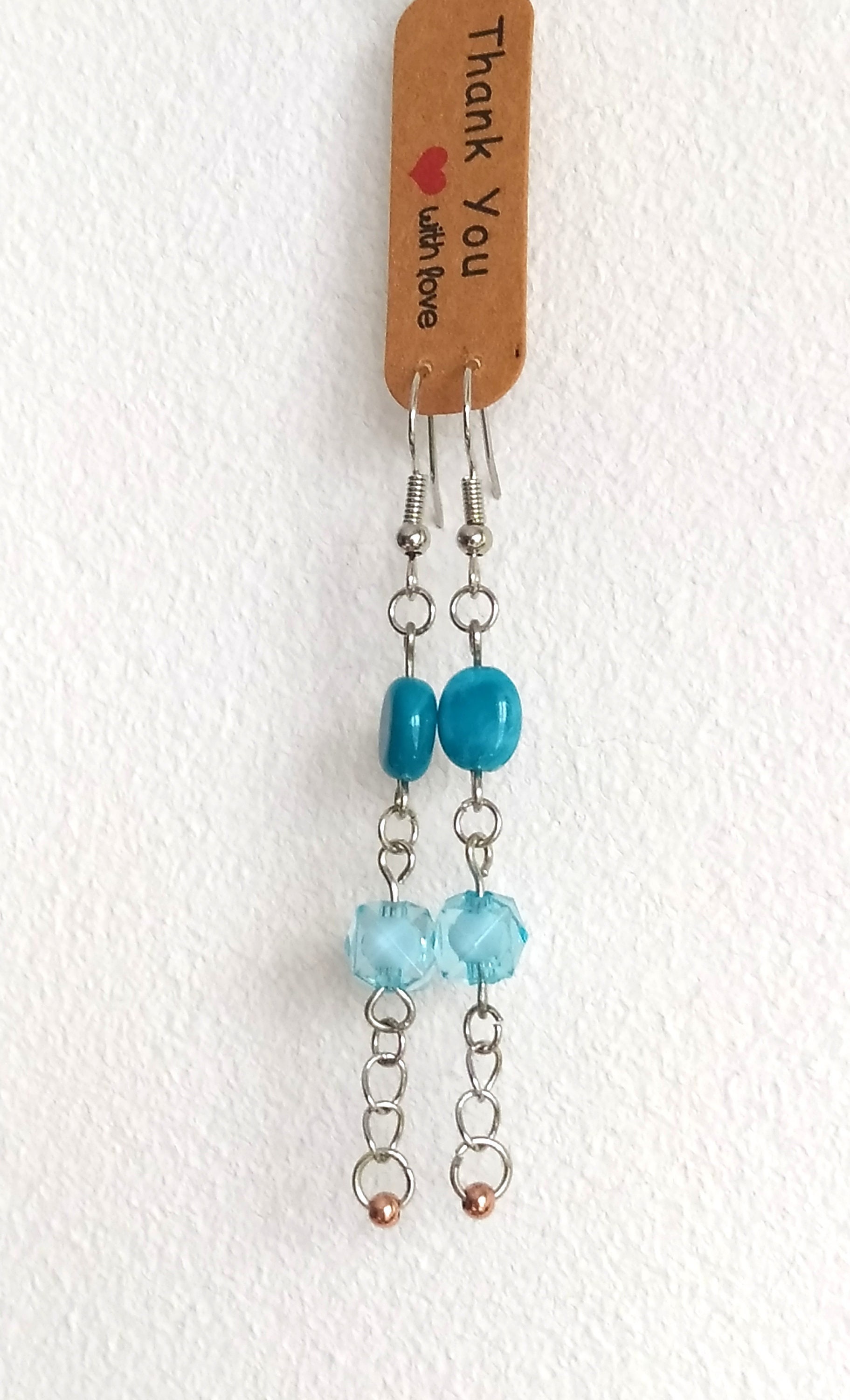 Beautiful earrings with beads made by hand in light blue crystal and  gold and sea colors, handmade with good energy