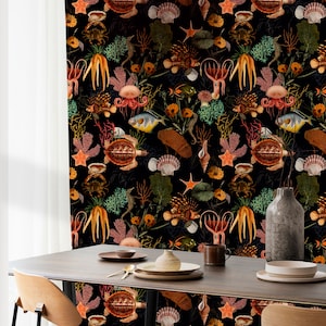 May include: A black background wallpaper with a repeating pattern of sea life, including starfish, seahorses, jellyfish, seashells, and fish. The wallpaper is in a dining room setting with a wooden table and chairs.