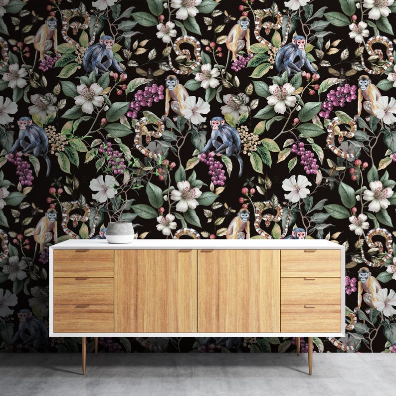 May include: A black wallpaper with a jungle design, including monkeys, snakes, flowers, and berries. The monkeys are grey and tan, the flowers are white, and the berries are purple.