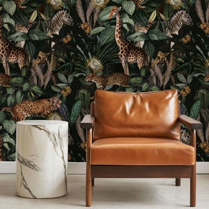 jungle wallpaper in moody dark tones: cheetahs, monkeys, giraffes, zebras and butterflies on dense botanical background