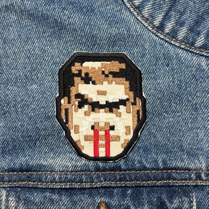 Geborduurde Doomguy-patch. Op games geïnspireerde patches. Opstrijkbare achterkant.