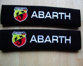 a new pair of beautifully embroidered abarth seat belt covers