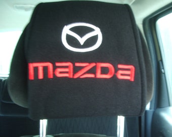 a new pair of beautifully embroidered mazda headrest covers
