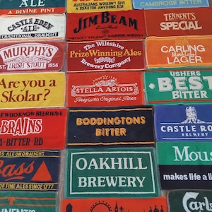 May include: A set of three ceramic mugs with a speckled, matte finish. The mugs are in shades of cream, light gray, and dark gray. Each mug has a simple, minimalist design, perfect for coffee or tea.