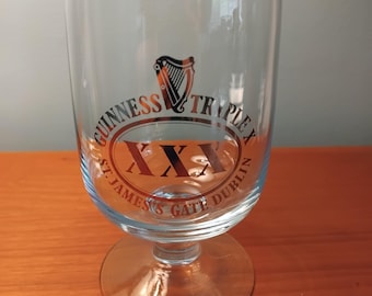 A Guinness triple X  half pint glass