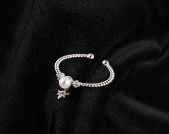 Anillo abierto de estrella colgante con perla
