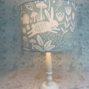 Sanderson luxury Nursery lampshade with a white wooden base