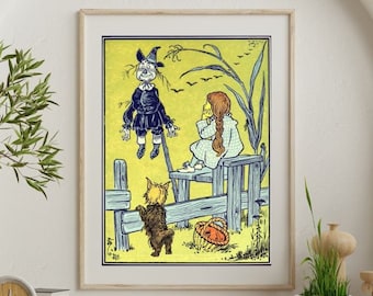 May include: A framed vintage illustration from the Wizard of Oz. The artwork depicts the Scarecrow, Dorothy, Toto, and a fence against a yellow background. The Scarecrow is in a black outfit, and Dorothy is in a white dress. The frame is a light wood color.
