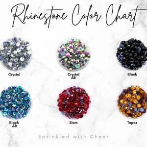 May include: A rhinestone color chart with six color variations: Crystal, Crystal AB, Black, Black AB, Siam, and Topaz. The text "Rhinestone Color Chart" is at the top, and "Sprinkled with Cheer" is at the bottom.
