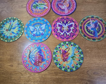 Set of 8 colorful Hummingbird and Butterfly coasters with cork backing and holder.
