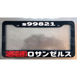 May include: Black license plate frame with white text "s99821" and red and white text "0 サ ン ゼ ル ス".