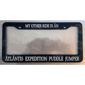 My Other Ride Is An Atlantis Expedition Puddle Jumper Glossy Black License Plate Frame