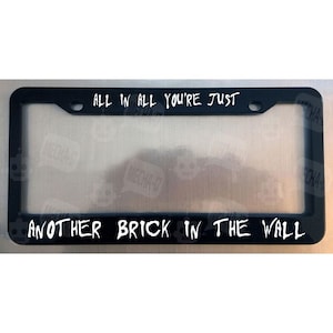 All In All You&#39;re Just Another Brick In The Wall Glossy Black License Plate Frame