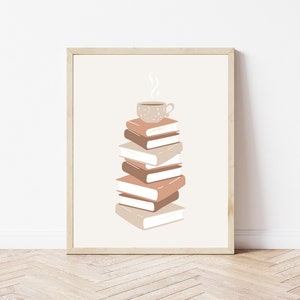 May include: A framed print with a stack of books and a cup of coffee on top. The books are in shades of brown and beige, and the coffee cup is brown with white speckles. The background is a light beige.