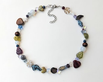 DEC handmade beaded necklace / whimsical glass stainless steel cottagecore fairy spiral swirl whimsigoth forest nature seashell fall leaves