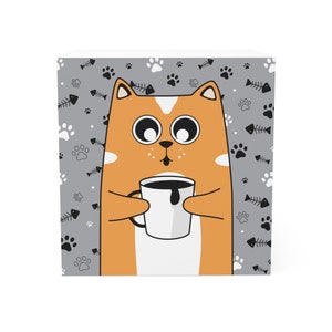 May include: Orange cartoon cat with big eyes holding a white coffee mug with black coffee. The background is gray with a pattern of paw prints and fish bones.