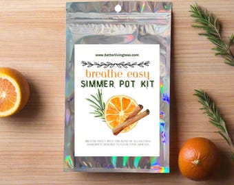 May include: A silver foil pouch with a white label that reads "breathe easy SIMMER POT KIT" and features a watercolor illustration of an orange slice, cinnamon sticks, and rosemary. The text "www.betterlivingteas.com" is printed at the top of the label. The label also includes the text "breathe freely with this blend of all natural ingredients designed to clear your airways."