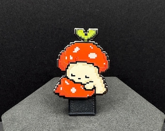 Pin esmaltado de seta dormilona - Serie Brotando - 3,8 cm