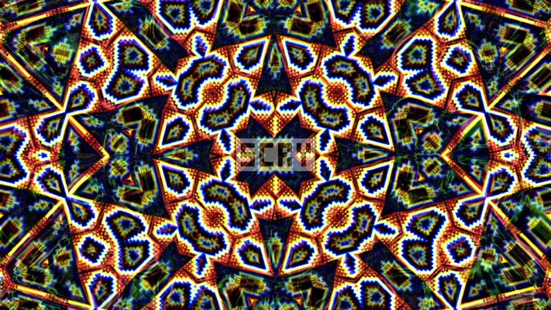 May include: Abstract digital artwork with a kaleidoscope effect. The design features a symmetrical pattern with repeating shapes in shades of blue, orange, yellow, and green. The image has a textured appearance and a vibrant, psychedelic aesthetic.