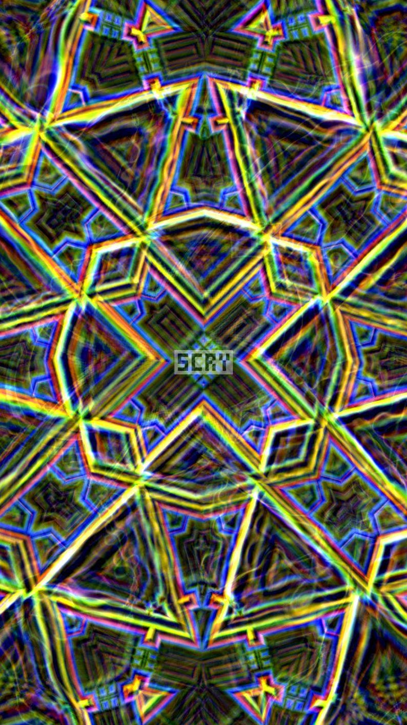 May include: Abstract digital art with a kaleidoscope effect. The image features a symmetrical pattern of geometric shapes in a variety of colors, including yellow, blue, and green. The word "SCRV" is in the center.