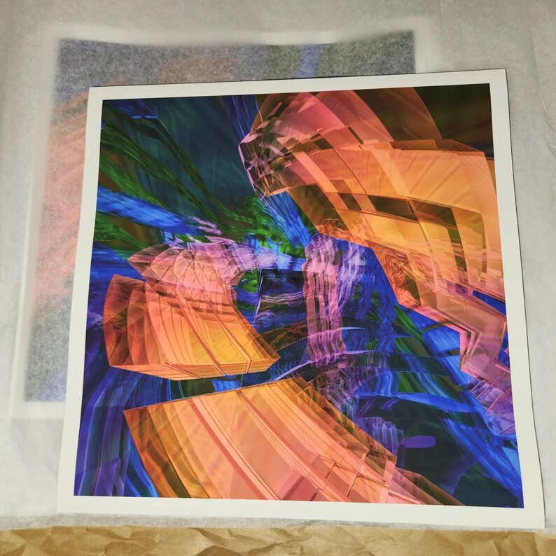 May include: Abstract art print featuring a vibrant composition of geometric shapes and flowing lines. The artwork showcases a blend of colors, including orange, blue, green, and pink, creating a dynamic and visually engaging piece. The print is on white paper.