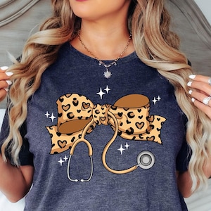 Coquette Nurse Stethoscope Bow Shirt, Christmas Gift for Nurse, Nurse Bow Shirt, Coquette Nurse Shirt, Nurse Gift,Leopard Nurse Ribbon Shirt