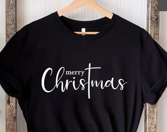 May include: Black t-shirt with white text that says "merry Christmas" in a cursive font.