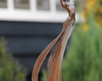 a bronze sculpture called "RELEASE THE BIRD" 39 cm high