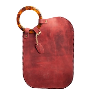 amber handle red clutch