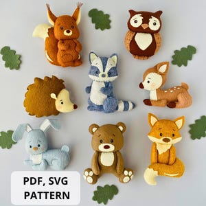 May include: A collection of handmade felt animal ornaments, including a squirrel, raccoon, owl, deer, hedgehog, bunny, bear, and fox. The animals are in various colors, with green leaf accents. The image includes the text "PDF, SVG PATTERN".