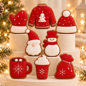 May include: A collection of eight red and white felt ornaments featuring a sweater, mitten, hat, gnome, snowman, mug with marshmallows, cup with whipped cream, and a gift bag, all decorated with embroidered snowflake and dot patterns.