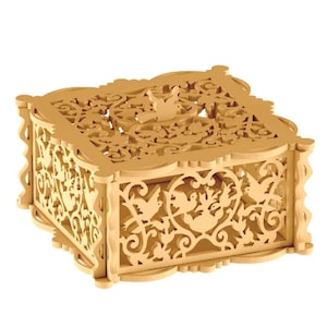 May include: A wooden box with intricate cutouts of birds and floral designs. The box is made of light brown wood and has a square shape.