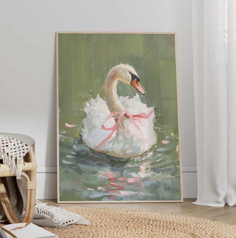 May include: A white swan with a pink ribbon around its neck floats on a green pond. The swan's head is turned to the side, and its feathers are ruffled. The water is calm and reflects the sky.