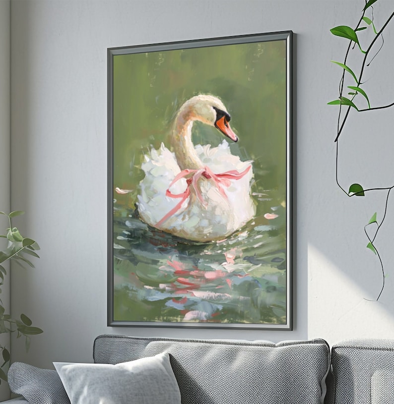 May include: A white swan with a pink ribbon around its neck floats on a green pond. The swan's head is turned to the side, and its feathers are ruffled. The water is calm and reflects the sky.