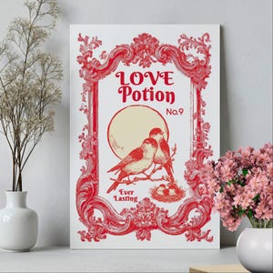 May include: A white canvas print with a red decorative frame and the words "LOVE Potion No. 9". The print features two red birds perched on a branch in front of a cream-colored moon. The words "Ever Lasting" are at the bottom.