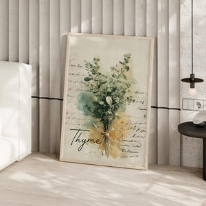 May include: A framed botanical print featuring a watercolor illustration of thyme. The artwork showcases a bundle of green thyme tied with twine, set against a backdrop of faded script and watercolor washes in shades of yellow and blue. The word "Thyme" is written in cursive.