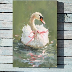 May include: A white swan with a pink ribbon around its neck floats in a pond with green water. The swan's reflection is visible in the water.