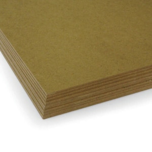 May include: A stack of brown cardboard sheets. The sheets are smooth and have a slightly textured surface.