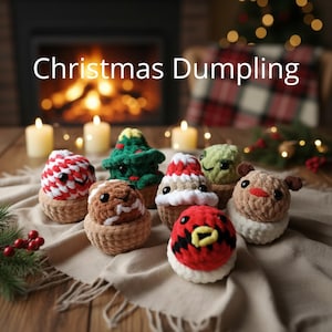 May include: A collection of six small, round, crocheted plush figures labeled Christmas Dumpling. The figures include a red and white striped ball, a green tree, a brown gingerbread-style character, a red and white hat, a green textured ball, and a brown reindeer with antlers, all featuring black plastic eyes.