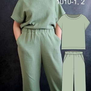 May include: A woman wearing a sage green two-piece outfit, consisting of a short-sleeved top and wide-leg pants. The image includes a pattern illustration of the outfit and text that reads "NeedGow PDF Patterns 1010-1, 2" and "S-6XL".