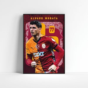 May include: Framed poster featuring soccer player Alvaro Morata in a Galatasaray jersey. The jersey is split, with one side orange and the other red. The number 77 is prominently displayed, with the player's name at the top.