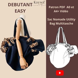 Könnte beinhalten: Eine dunkelblaue Utility-Tasche mit Leopardenmuster-Akzenten an den Seiten und Griffen, präsentiert an einer Schaufensterpuppe. Das Bild enthält den Text: DEBUTANT EASY, Kaysol Couture-Paris, Patron PDF A0 et A4+ Vidéo und Sac Nomade Utility Bag Multitasche.
