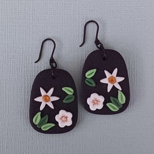 Beautiful Black Earrings with White and Gold Coloured Flowers and Hypoallergenic Plastic Hooks