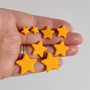 4 pairs of handheld yellow star shaped stud earrings