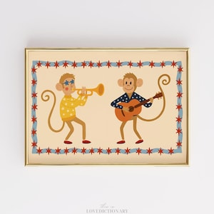 Könnte beinhalten: Ein gerahmter Druck mit zwei Cartoon-Affen, die Musik spielen. Einer der Affen spielt Trompete, der andere Gitarre. Der Druck hat einen cremefarbenen Hintergrund mit einem rot-blauen Sternenrand.